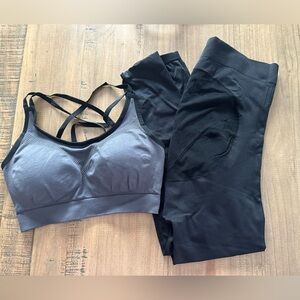 Black and grey sports bra and athletic leggings.